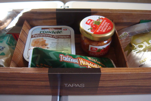 a wooden box with food in it