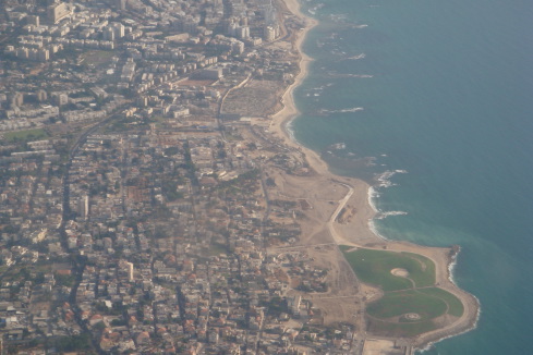 an aerial view of a city and a beach