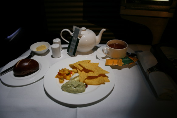 a plate of food and tea on a table