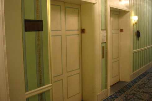 a row of elevators in a hotel