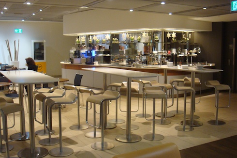 a bar with chairs and tables
