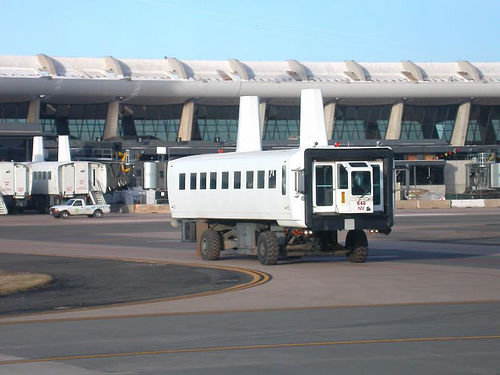 a white truck on a runway