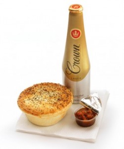 a close-up of a pie and a bottle of sauce