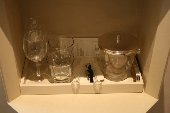 a tray with glasses and a jar on it