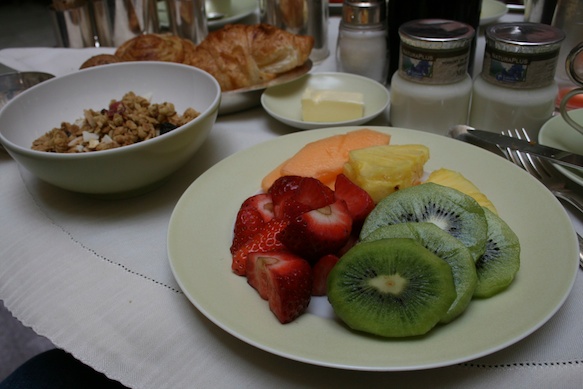 a plate of fruit and cereal