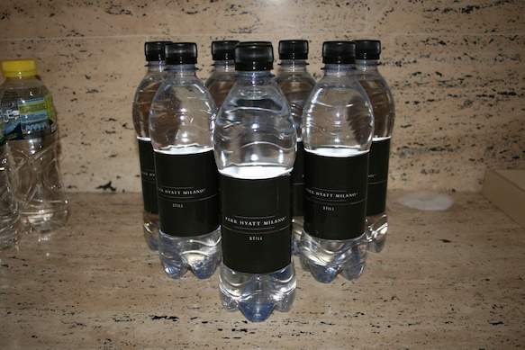a group of water bottles with black labels