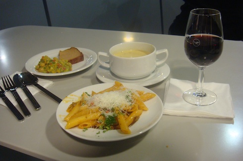 a plate of pasta and a glass of wine