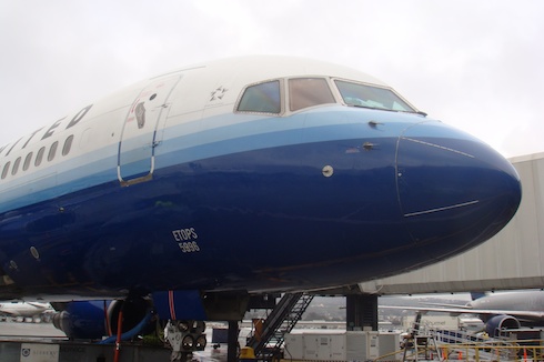 a close-up of a blue and white airplane