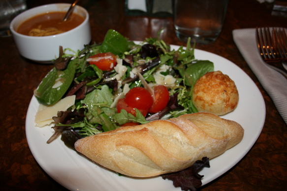 a plate of salad and bread