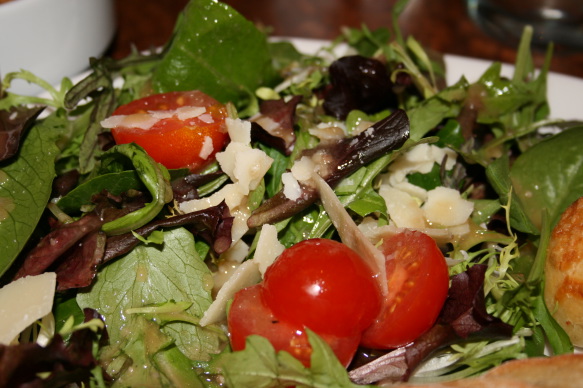 a salad with tomatoes and cheese