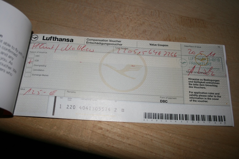 a voucher with red writing on it