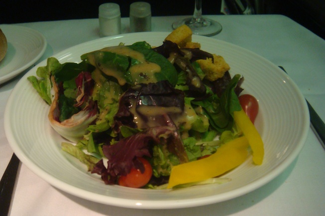 a plate of salad with sauce