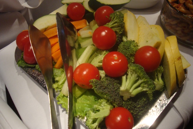 a plate of vegetables and a spoon