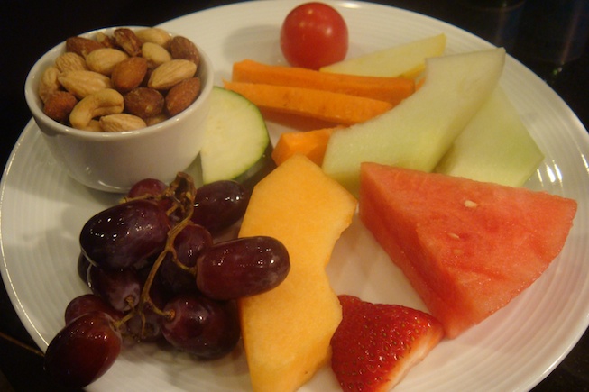 a plate of fruit and nuts