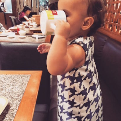 Lucy "drinking" tea at Din Tai Fung in Bangkok