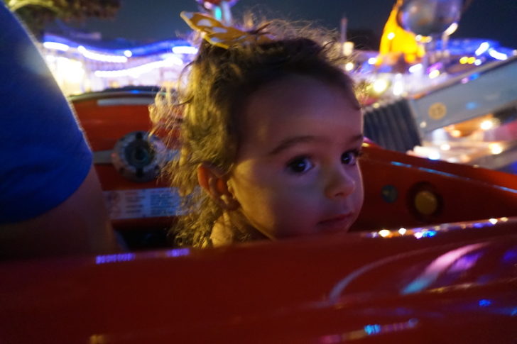 a child in a carnival ride