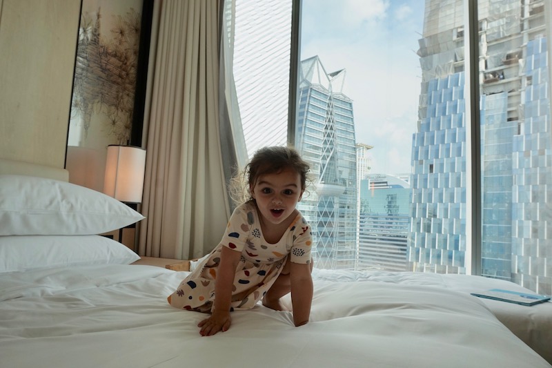 a child crawling on a bed