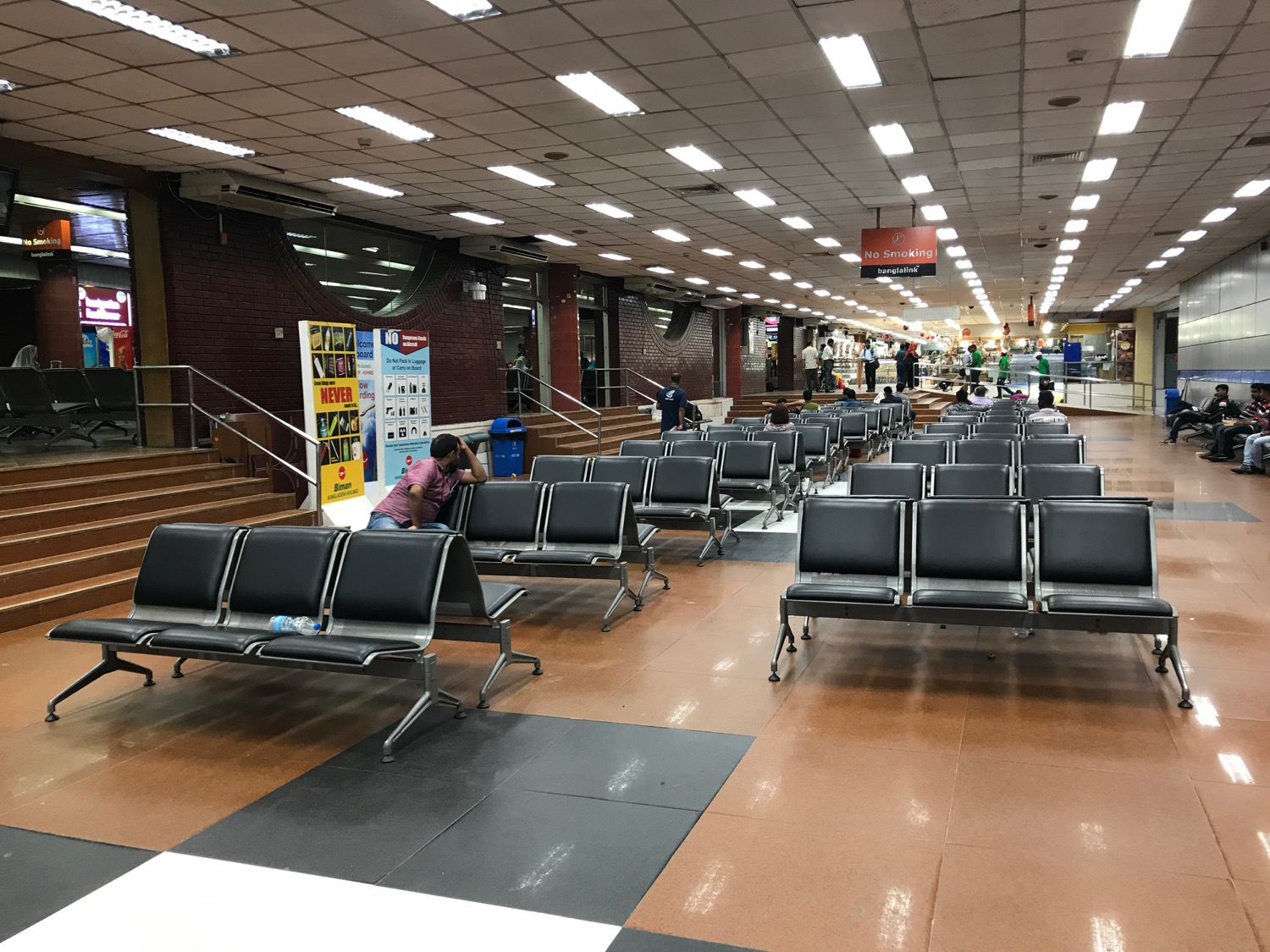 a group of chairs in a terminal