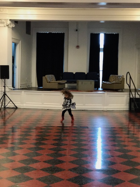 Lucy tearing it up on the original red tile floors of the ballroom.