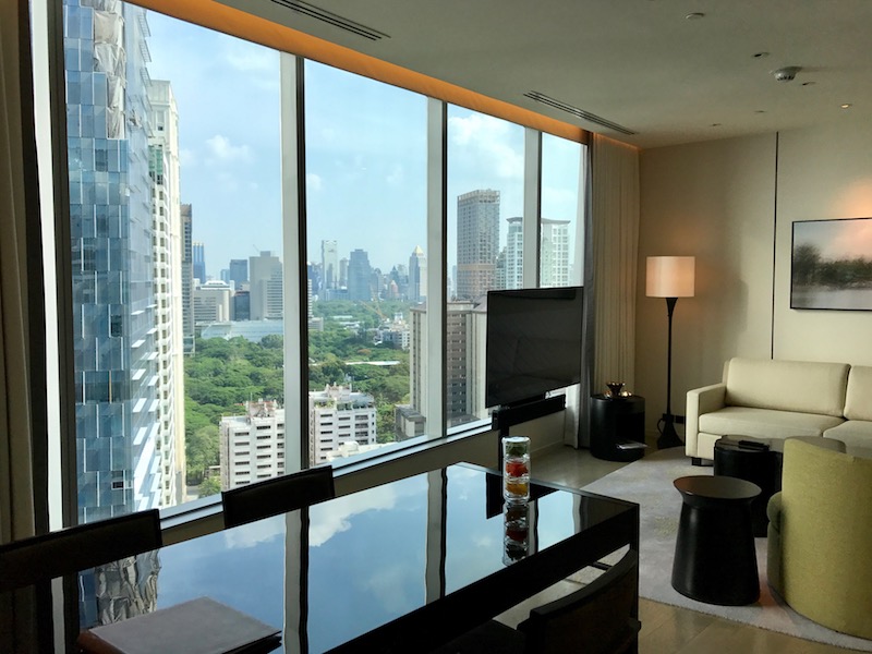 a room with a large window and a city view