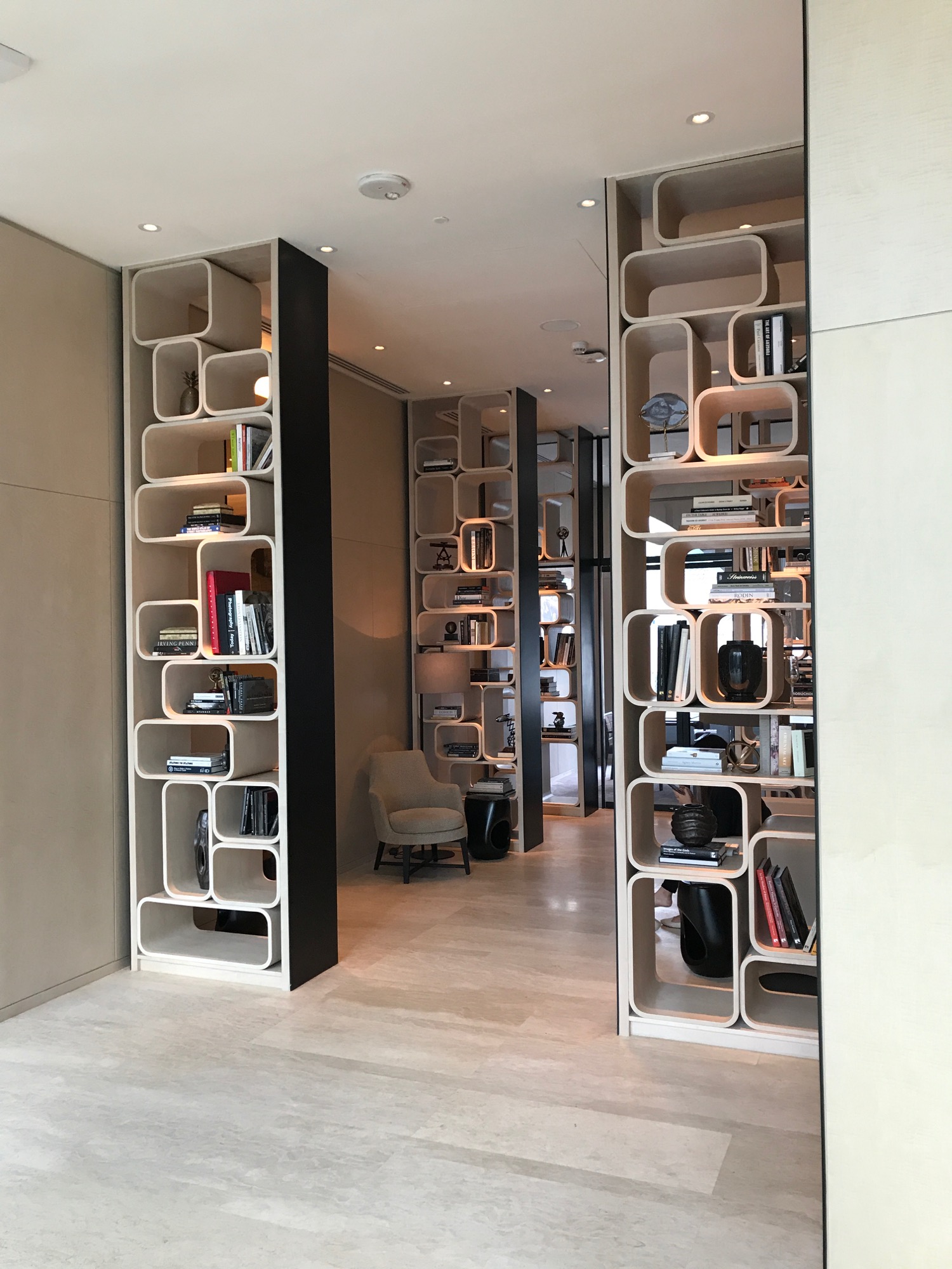 a room with bookshelves and a chair