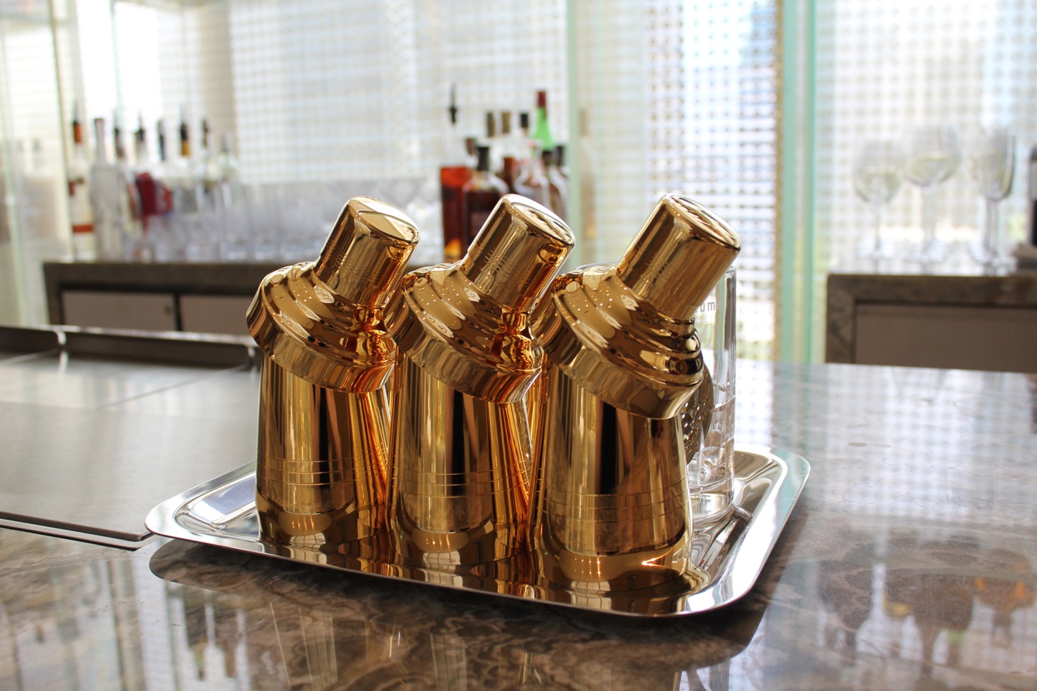 a gold shakers on a tray