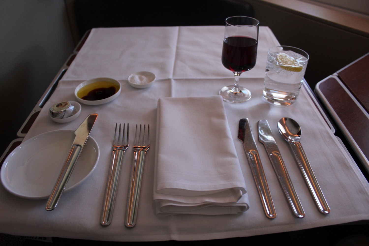 a table with a white napkin and silverware