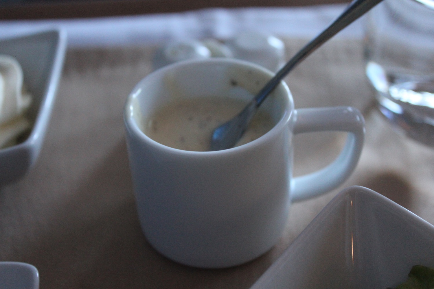 a cup of coffee with a spoon