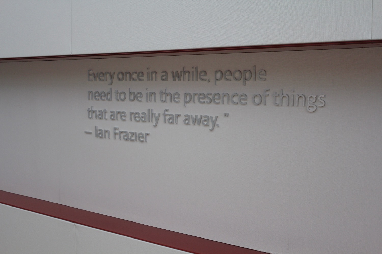 a white wall with a quote on it