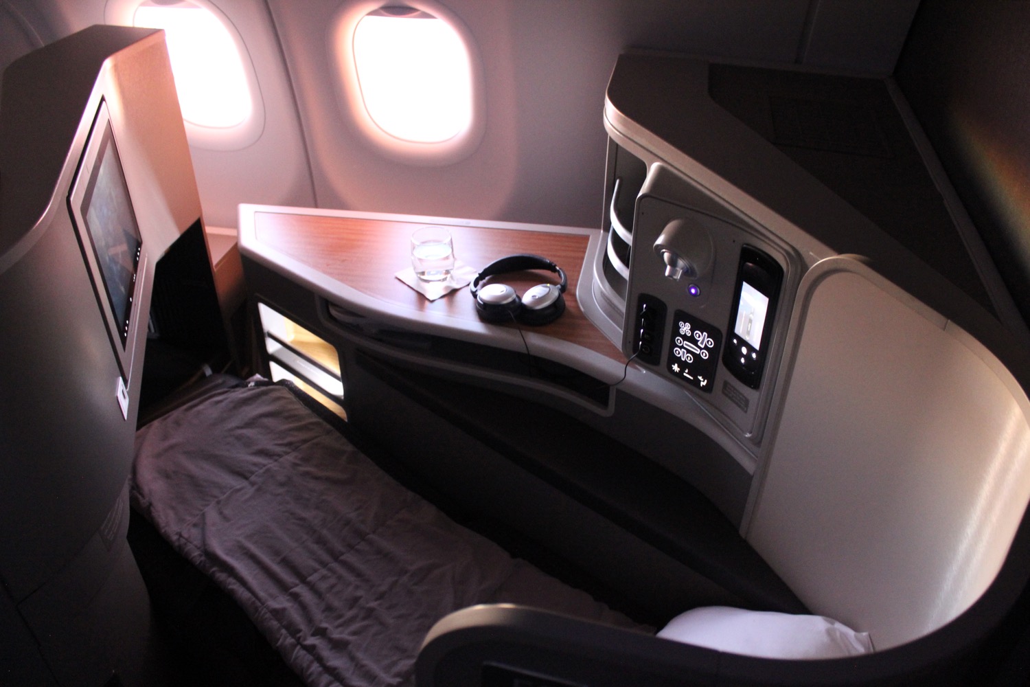 headphones on a bed in a plane