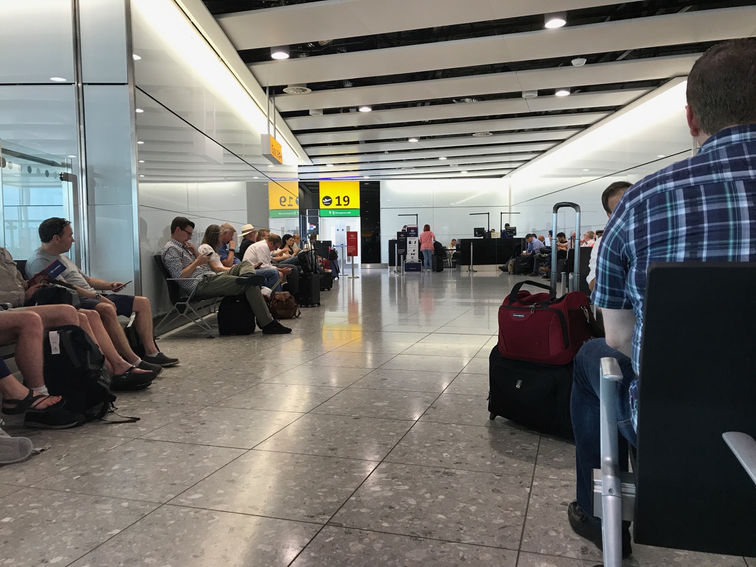 a group of people sitting in a terminal