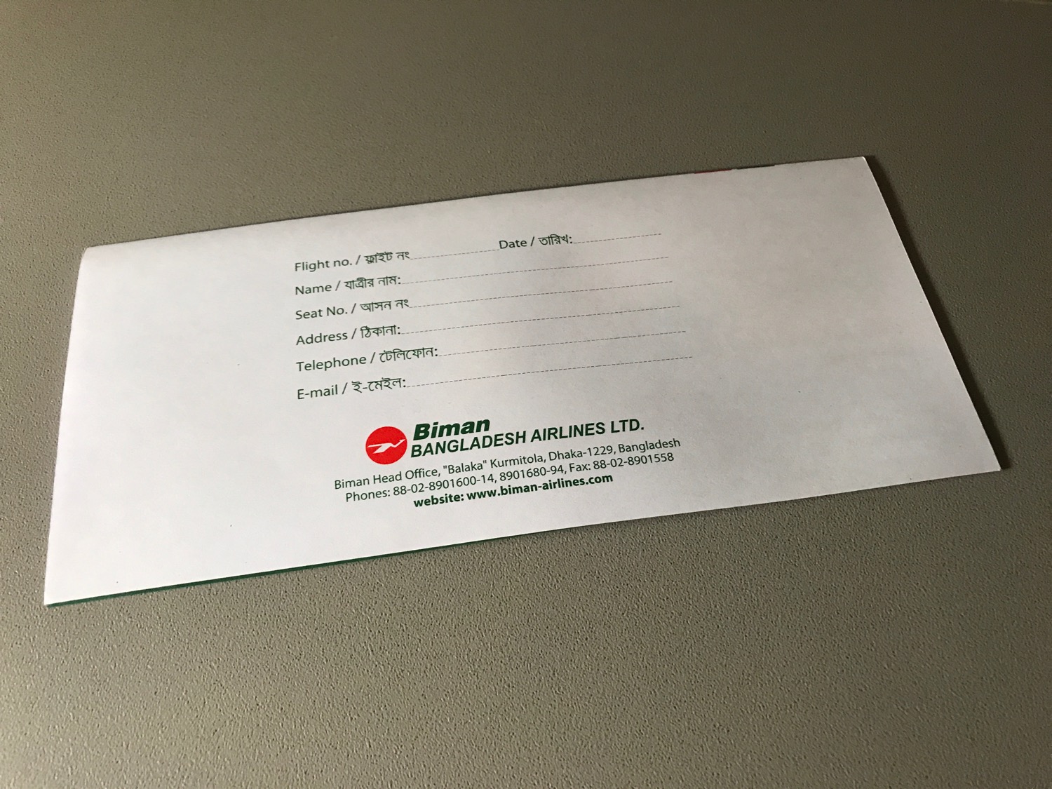 a white envelope with green text on it