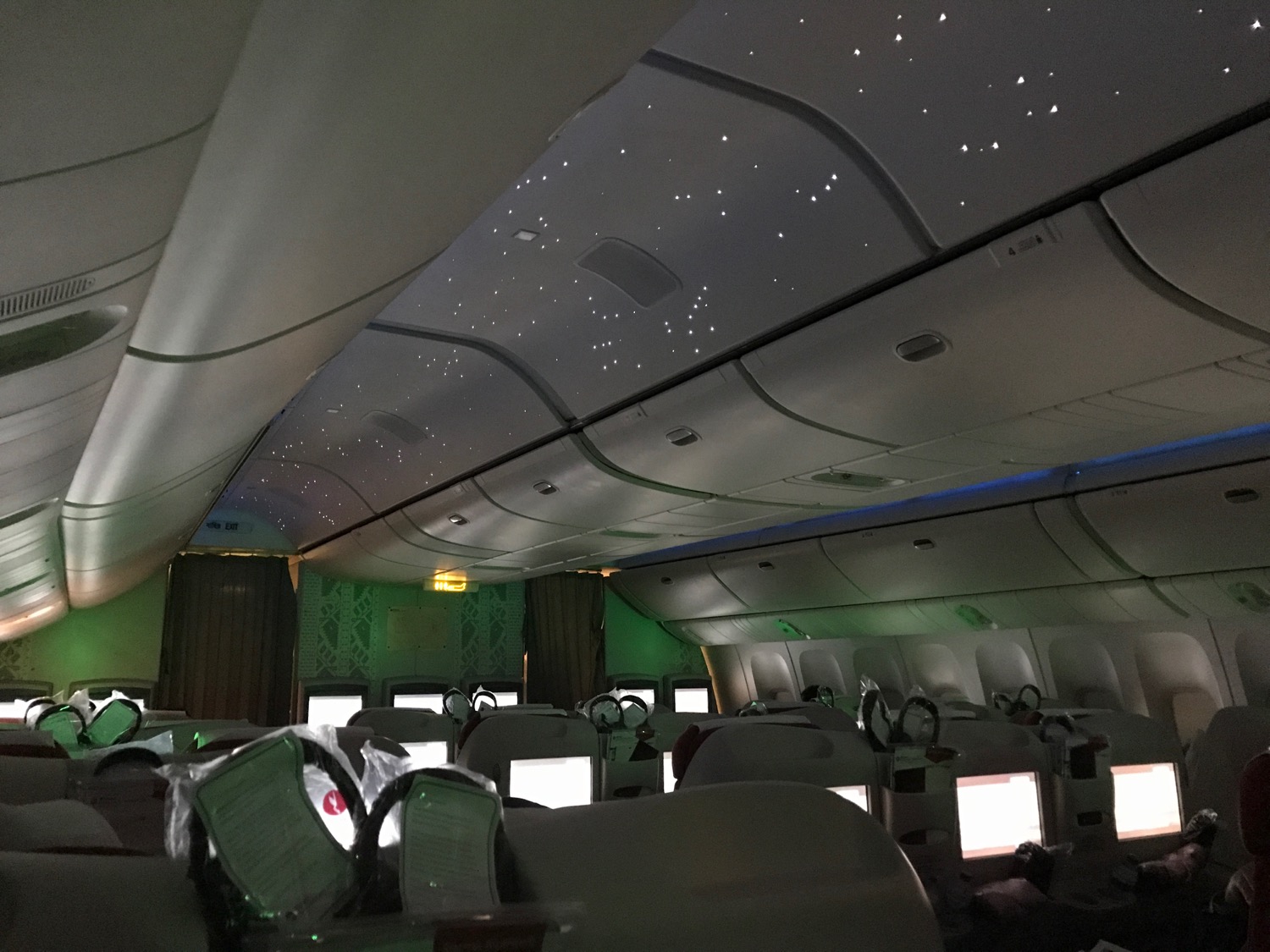 inside an airplane with lights on
