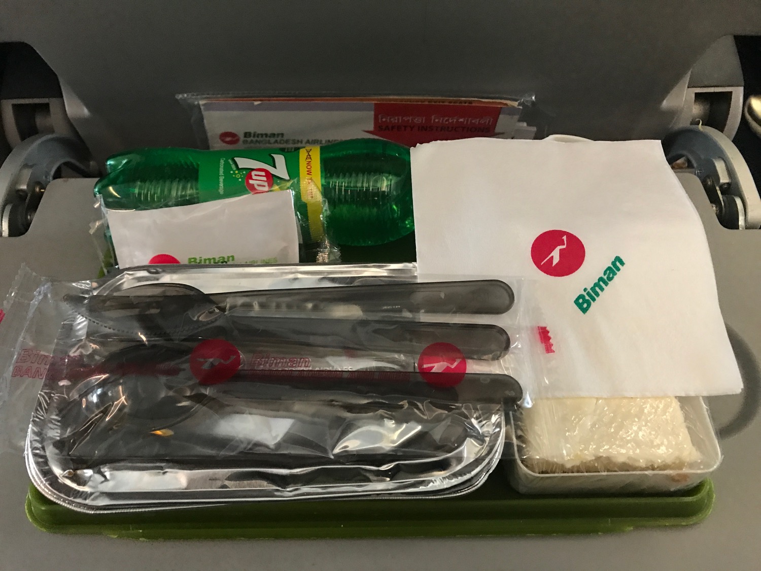 a tray with food items and a napkin