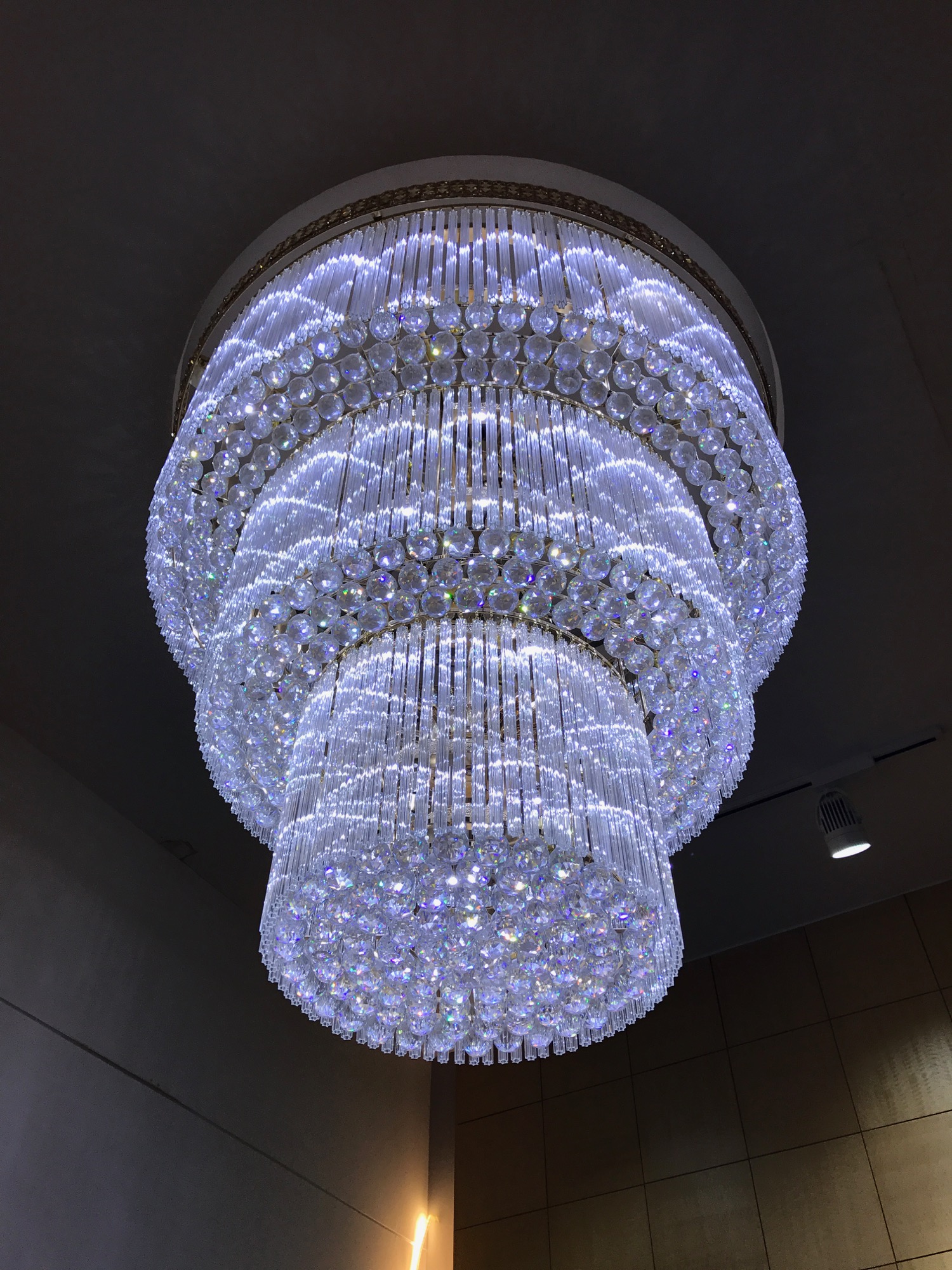 a large chandelier with crystal beads from the ceiling