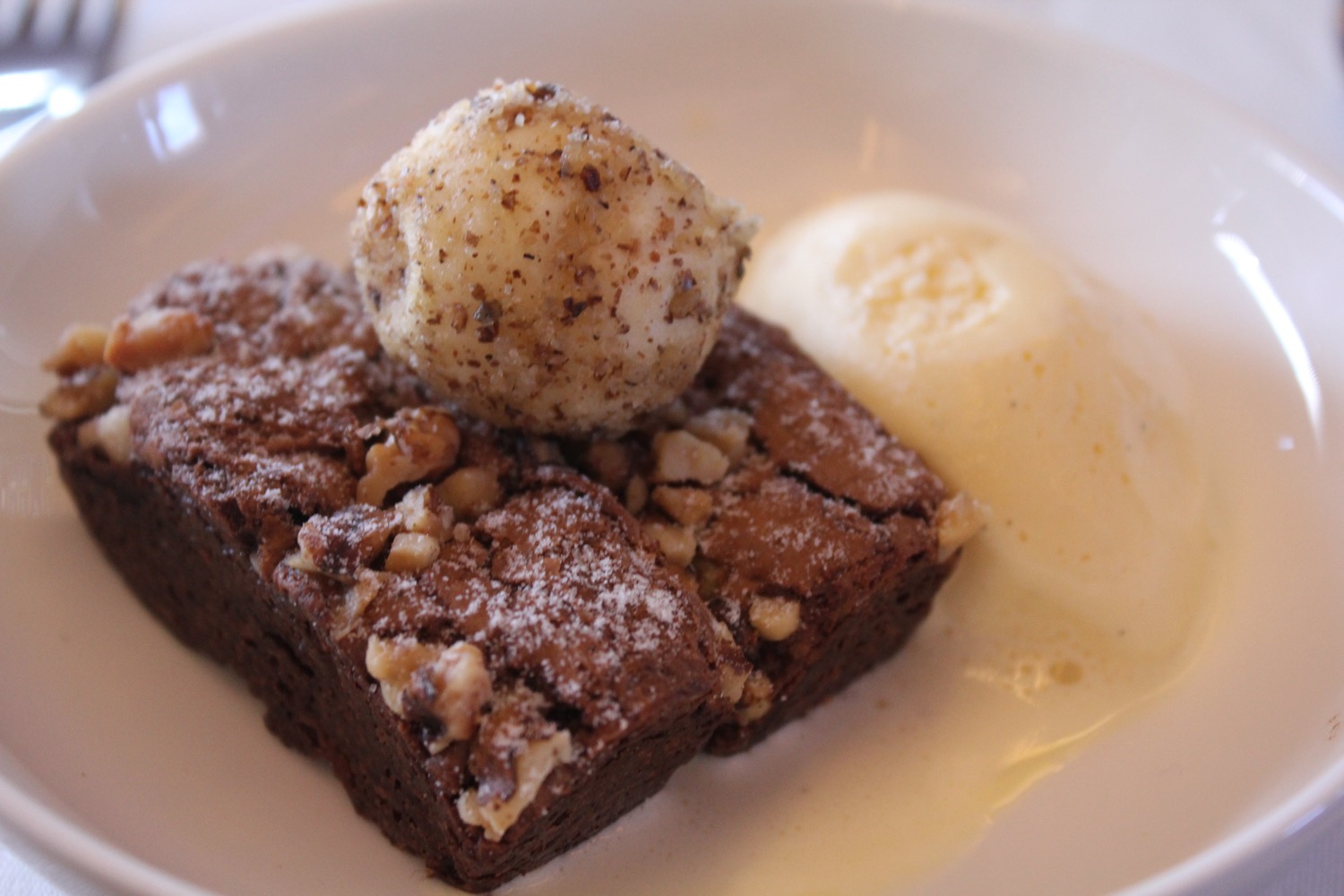 a brownie and ice cream on a plate