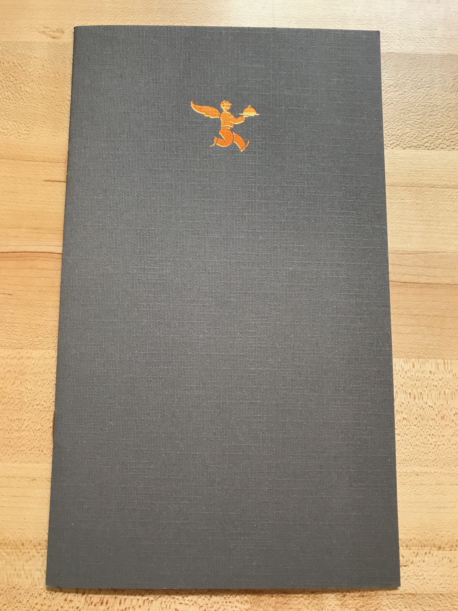 a grey mat with an orange figure on it