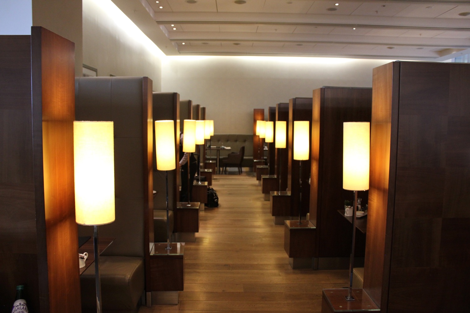 a room with rows of tall lamps
