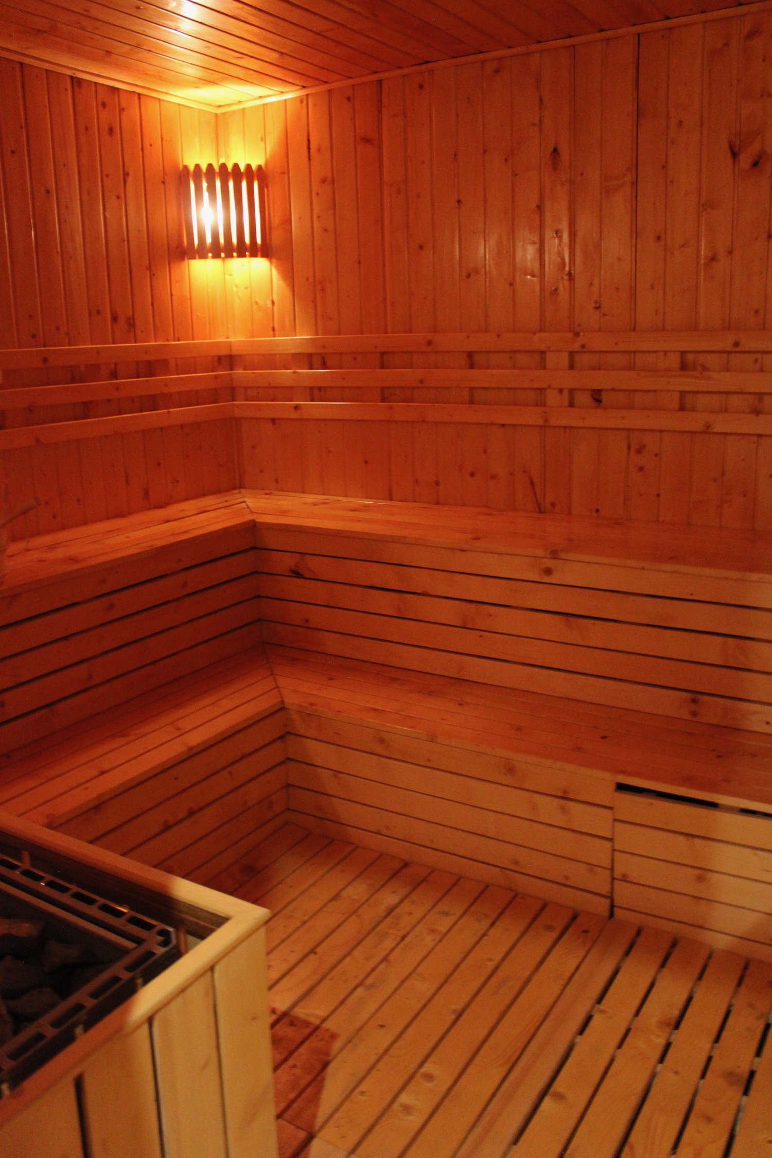 a wooden sauna with a hot tub
