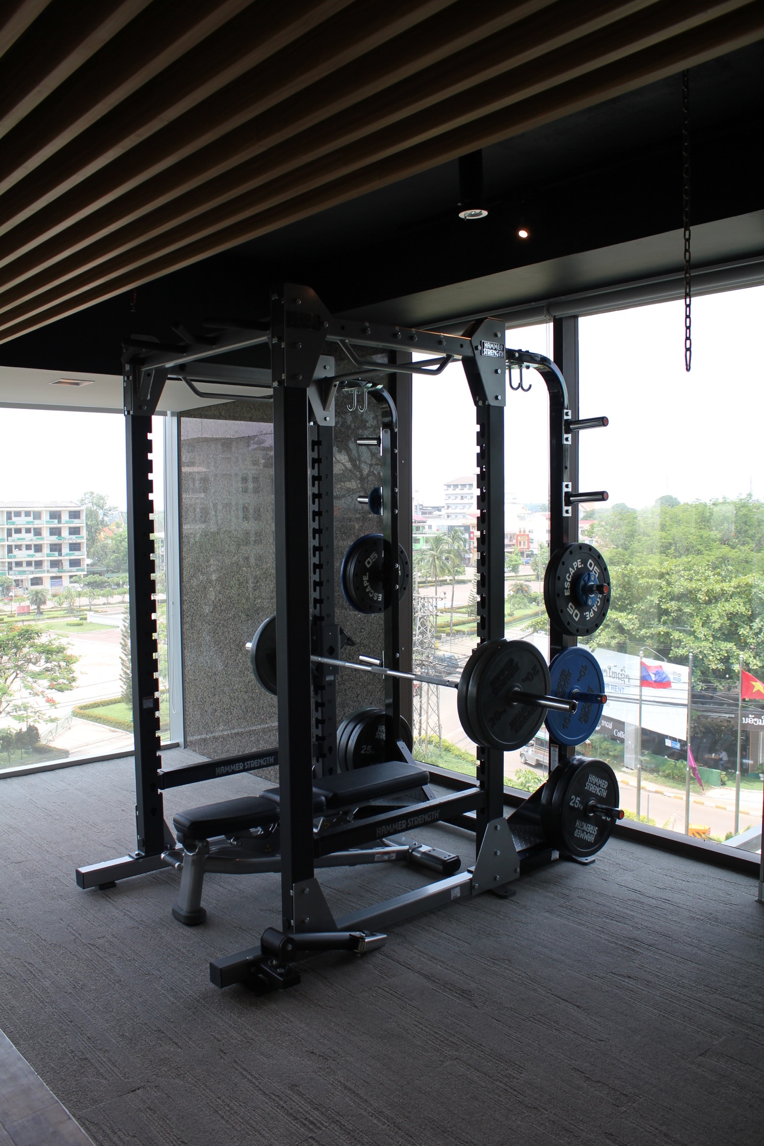 a gym with weights and a window