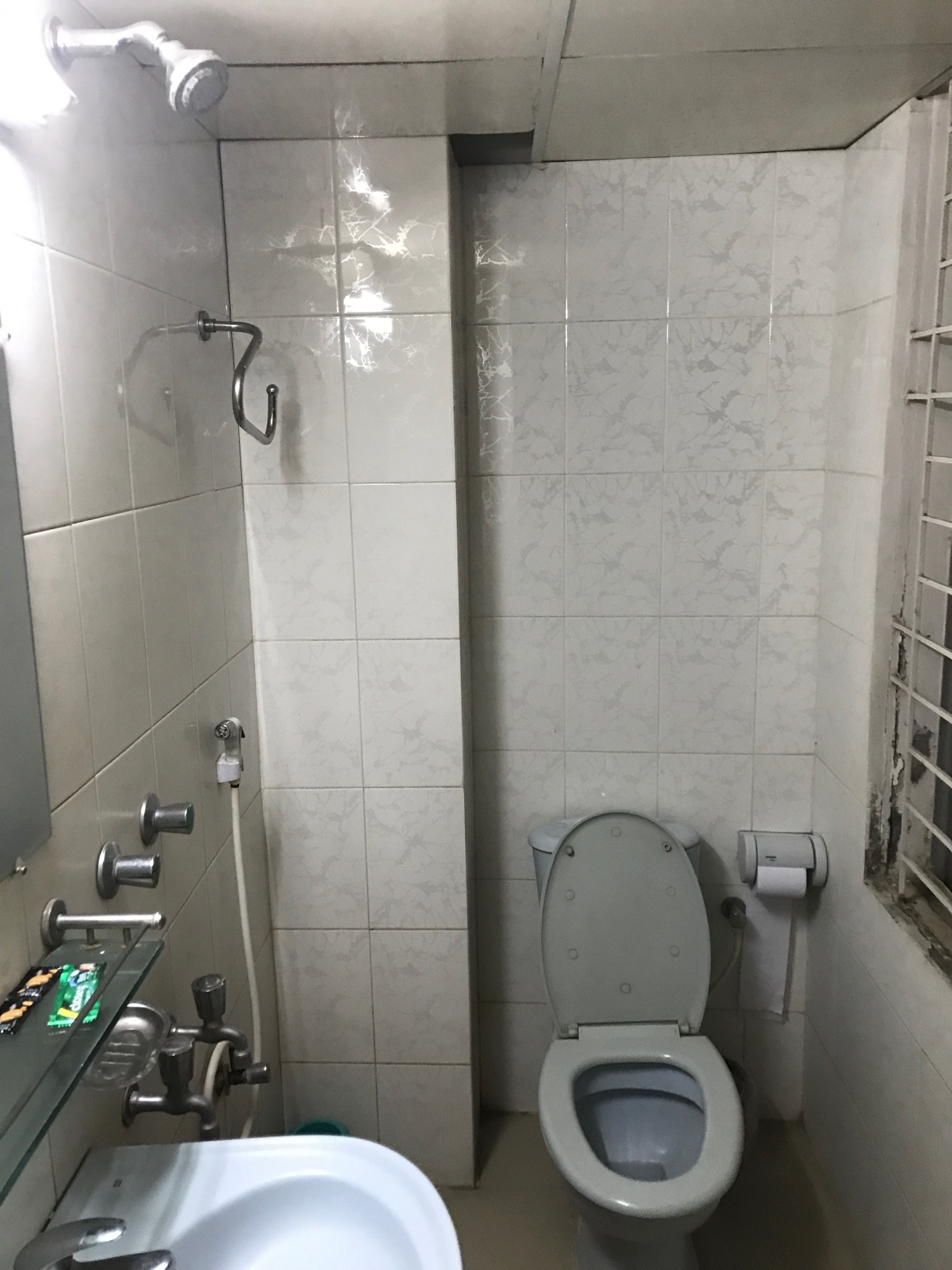 a bathroom with a toilet and shower