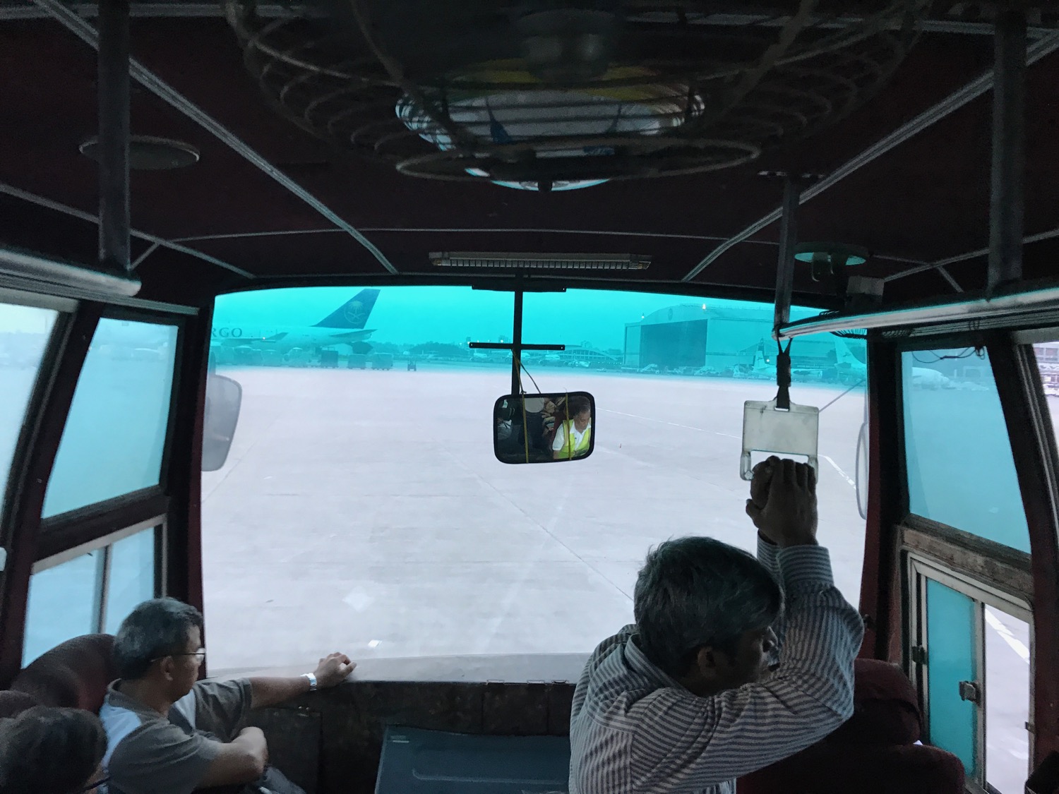 a group of people sitting in a bus
