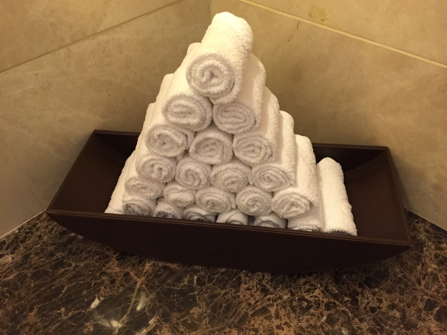 a stack of towels in a bowl