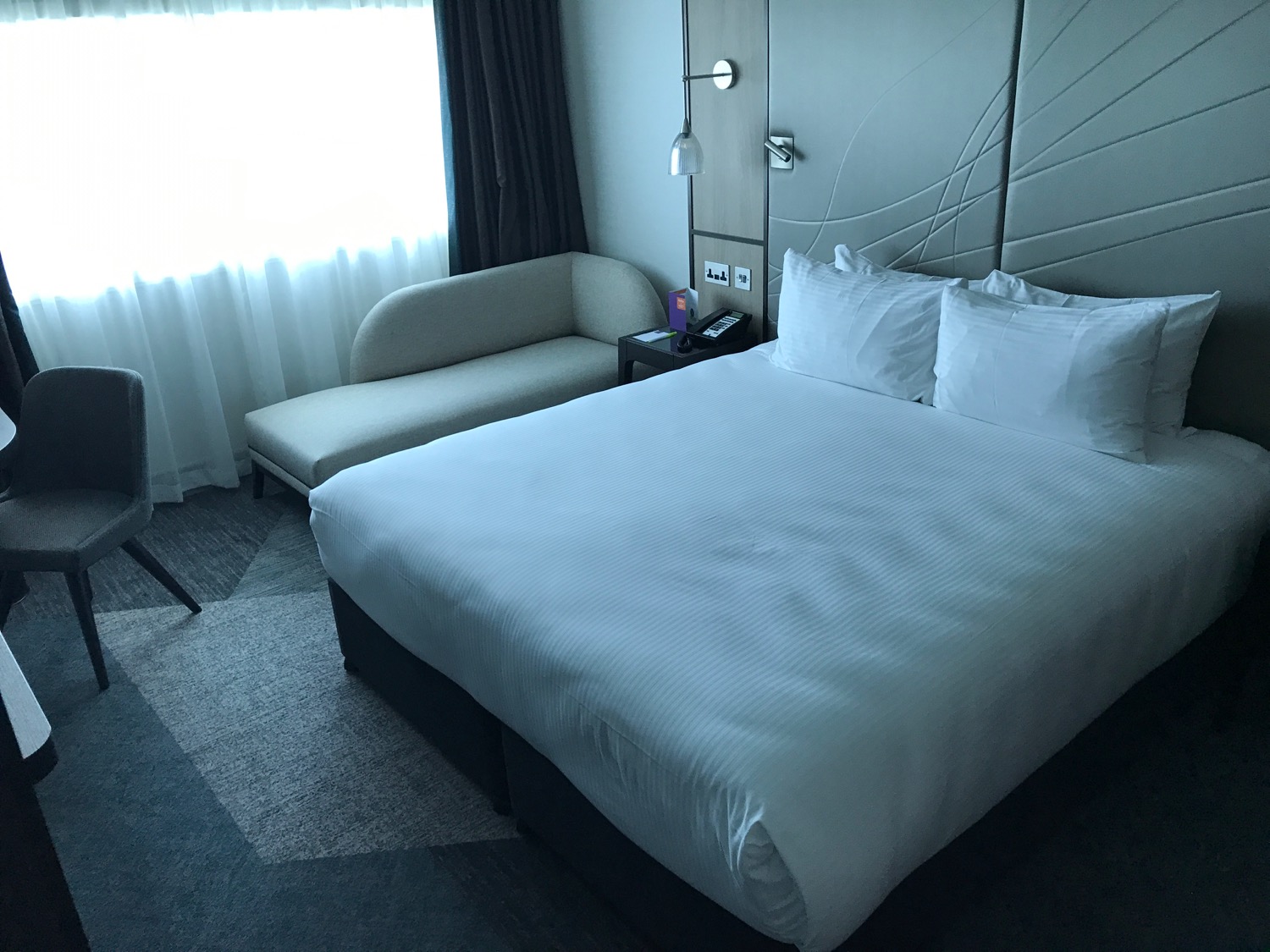 a bed and a couch in a hotel room