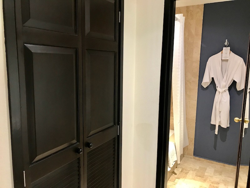 Closet with safe opposite bathroom vanity