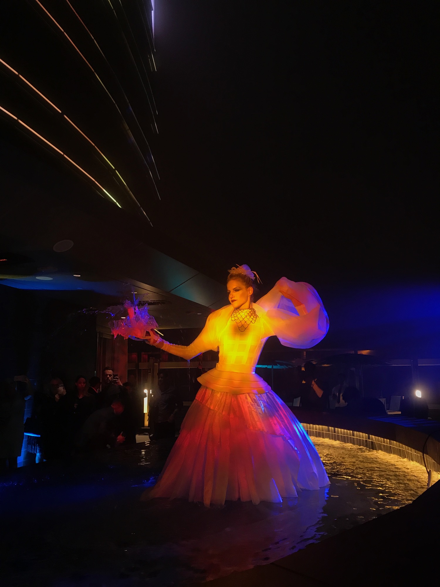 a woman in a dress with lights