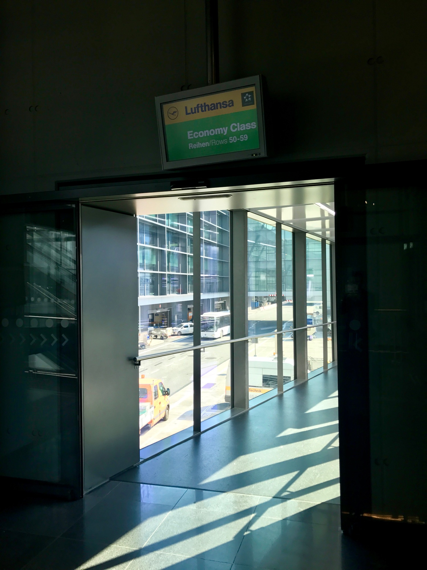 a glass doorway with a sign on the side