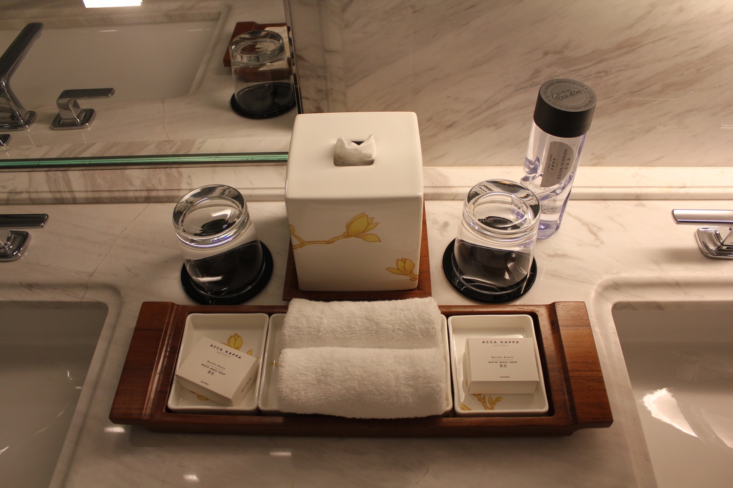 a bathroom counter with a towel and toiletries