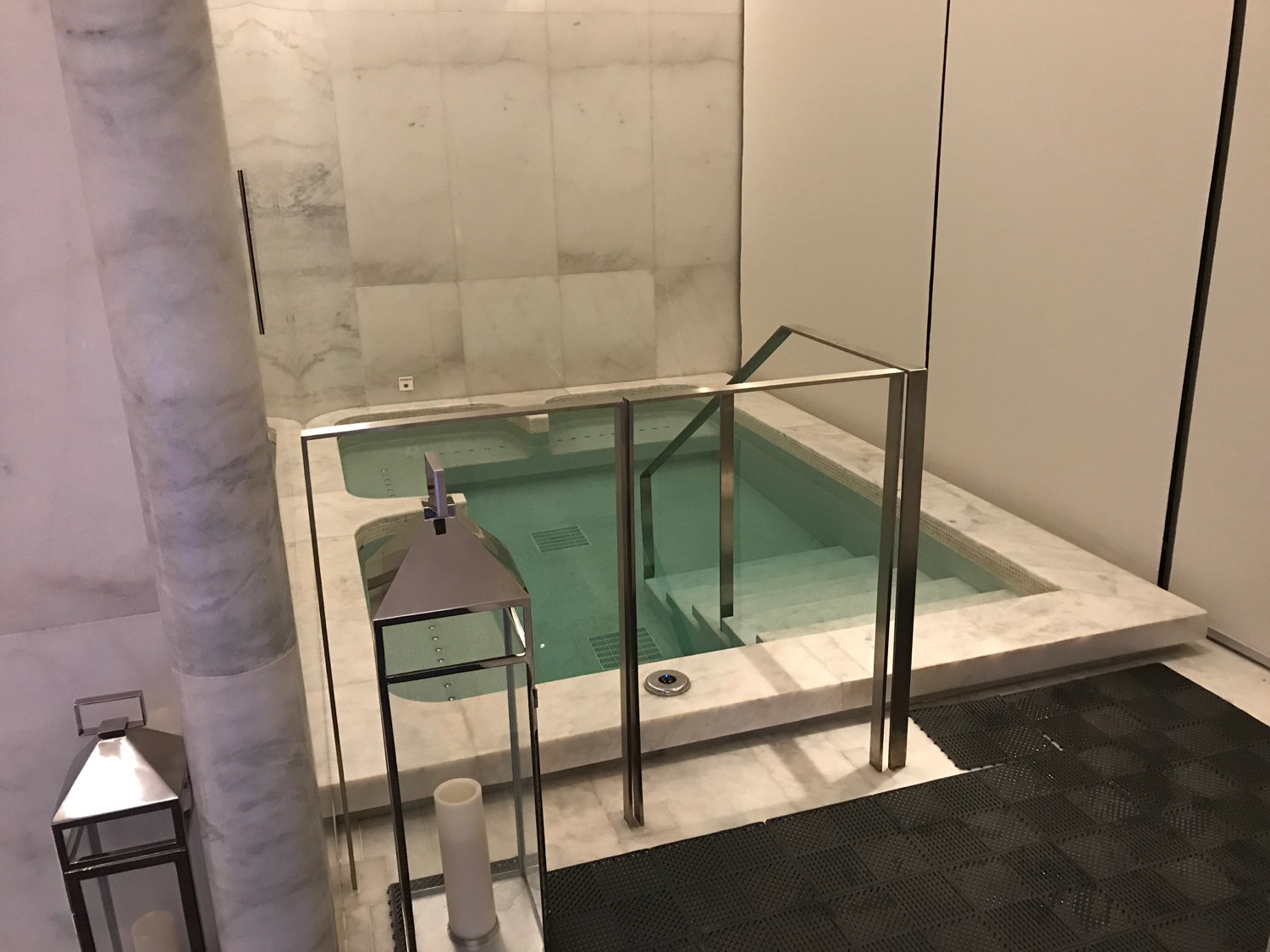 a jacuzzi with a glass door