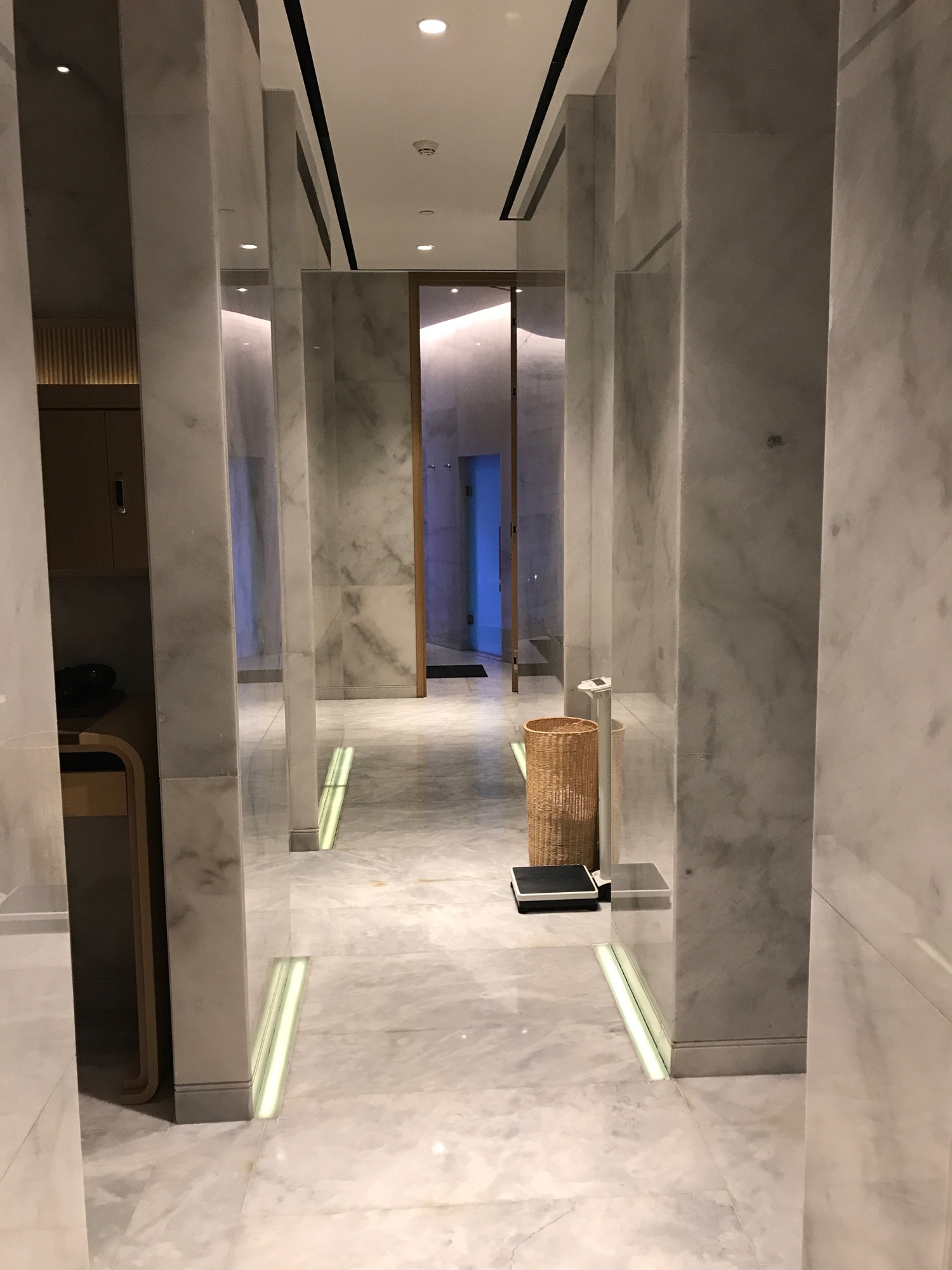 a marble hallway with a mirror